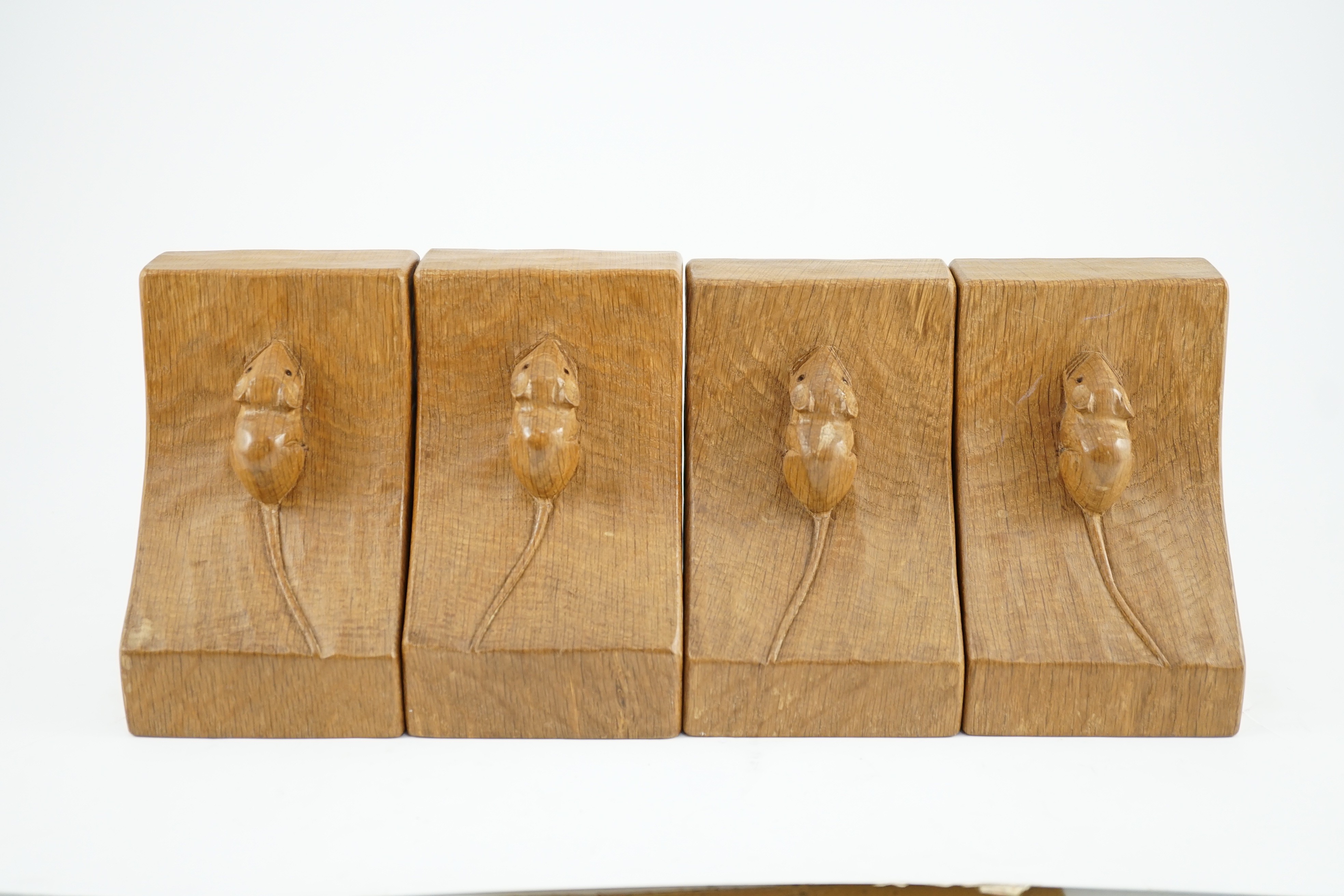 Two pairs of Robert Thompson Mouseman Thompson oak bookends, width 9.5cm depth 9.5cm height 15cm